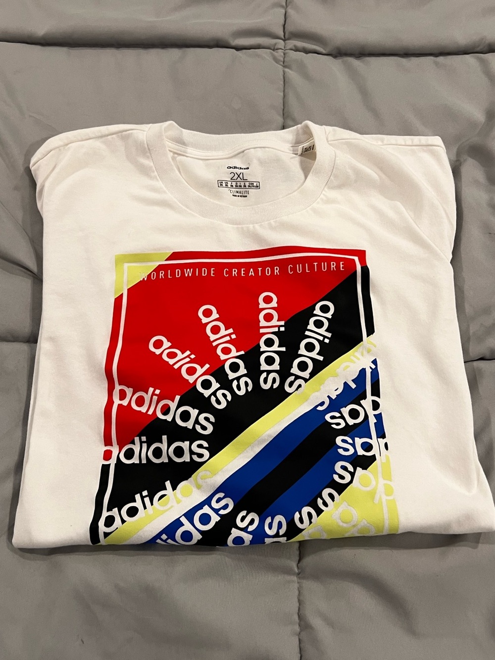 adidas Men's 2XL White Graphic Tee with Red, Black, Blue & Yellow Print